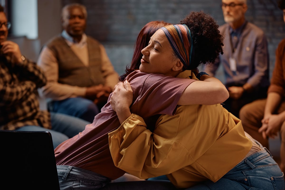 Women in a supportive group, embodying community and healing